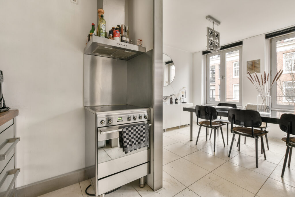Interior of modern kitchen with chrome plated furniture